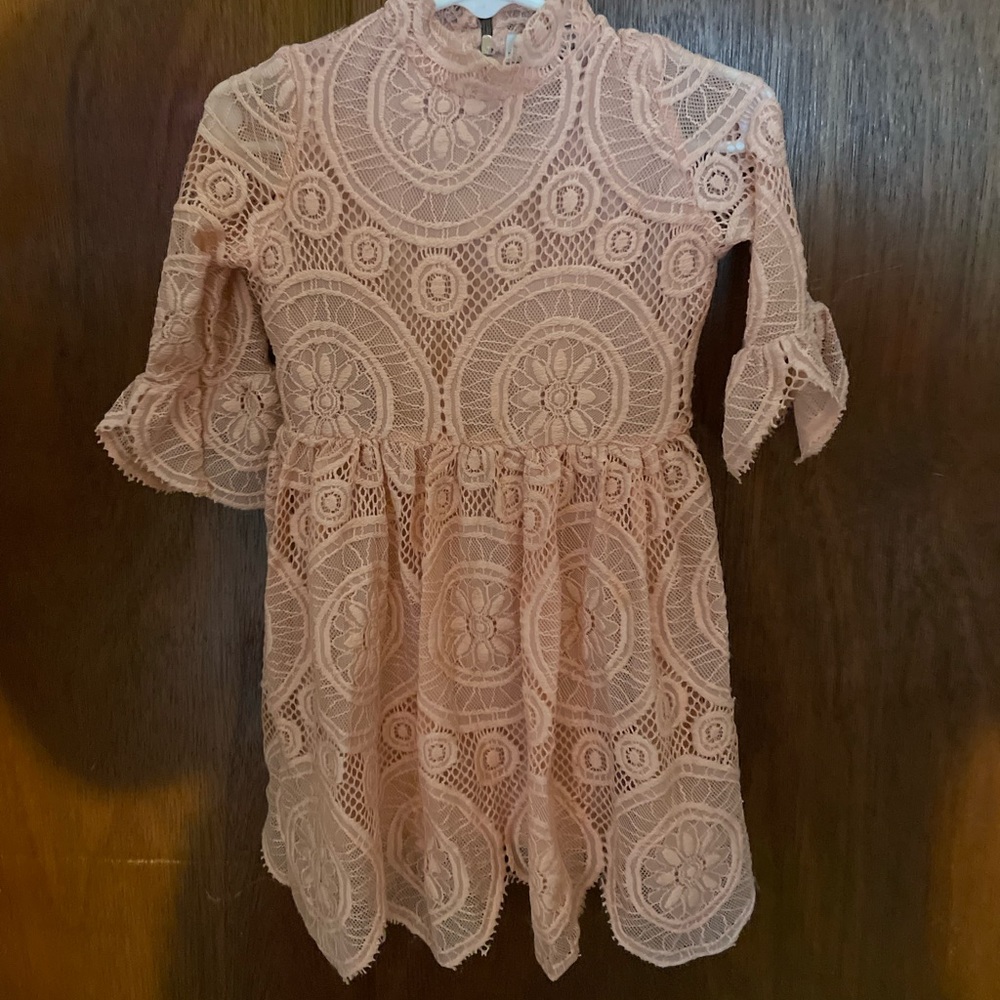 Blush colored Baileys Blossoms Romper 12-18 months but fits bigger IMO.